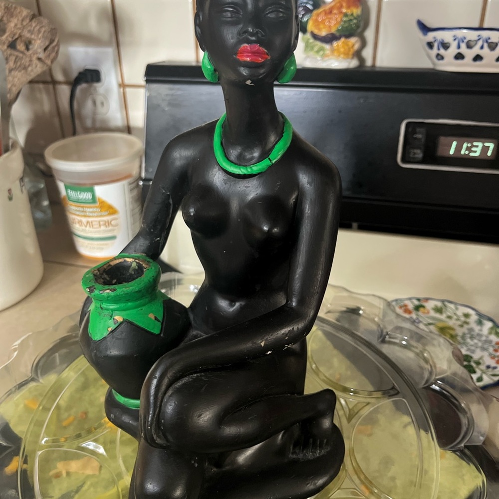 Elegant Black Figurine with Green Details